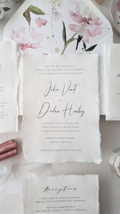 the wedding stationery is laid out and ready to be put into their guests'names