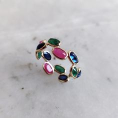 This stunning stackable ring is set in Solid Yellow Gold with Natural Emerald, Ruby and Blue Sapphire. It is an unique & dainty gemstone ring for nearly every occasion and is completely hassle-free jewelry. ITEM DETAILS: * Gem: Emerald  * Gem Size: 3X5mm (4pcs) * GEM SHAPE: Oval Cut * Gem Weight: 0.89 carats * Gem: Ruby  * Gem Size: 3X5mm (4pcs) * GEM SHAPE: Oval Cut * Gem Weight: 1.50 carats * Gem: Blue Sapphire * Gem Size: 3X5mm (5pcs) * GEM SHAPE: Oval Cut * Gem Weight: 1.74 carats * Gold Pur Multicolor Ring With Bezel Setting, Adjustable Multi-stone Stackable Rings Fine Jewelry, Multicolor Bezel Set Ring, Adjustable Multi-stone Stackable Fine Rings, Multicolor Stackable Rings For Promise, Adjustable Multi-stone Stackable Rings, Multicolor Open Stackable Rings For Promise, Adjustable Multicolor Multi-stone Rings, Multicolor Stackable Birthstone Ring For Promise