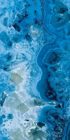 an aerial view of blue and white water