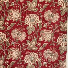 a red and gold fabric with flowers on the side, in an ornate pattern that is very