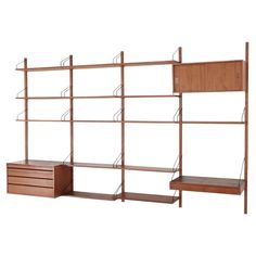 the shelving unit is made out of wood and has shelves with drawers on each side