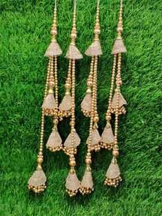 Indian Handmade Golden Beaded Lahenga Latkan Tassels for Saree HandBags Hangings Dupatta Bridal Wedding dress for Women pair of 2 pcs Size - 32 cm Length  Item Description You can use this Beautiful pair of tassle for several DIY projects.  *These beautiful Tassel Latkans are used as the accessory for Lahenga and saree , but u can use according to your need and your innovative ideas. * Package contains 2 Latkan / 1 Pair you can use these latkans in various ways Craft Projects Designing Home Decoration Festive celebrations. Evening and party Apparels. Home décor items Apparel & Fashion Scarves n Stoles Headband, hats Table cover, curtains, Pillow covers, Cushion cover Shoe designing Headband, hats Table cover, curtains Designing stylish blouses Ship From New Delhi, India 2 Latkan / 1 Pair Luxury Chandbalis With Latkans For Wedding, Traditional Beaded Sets For Festive Season, Traditional Festive Beaded Sets, Festive Traditional Beaded Sets, Lehenga With Latkans For Festivals And Celebrations, Wedding Sets With Tassels For Diwali, Festive Wedding Sets With Tassels, Tassel Sets For Navratri Wedding, Traditional Festive Sets With Tassels