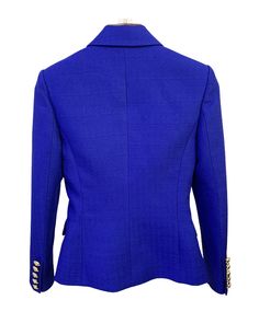 Eliza Royal Blue Double Breasted Blazer with Gold Buttons - SLIM FITFeatures: - Slim Fit Design - Single Gold Button Closure - Gold Button Cuffs - Peak Lapels - Two Faux Side Pockets - Shoulder Padding The Eliza Royal Blue Double Breasted Blazer is a bold and regal piece that adds a touch of elegance to any outfit. The deep shade of blue is both stylish and eye-catching, while the fitted silhouette creates a flattering and polished look. The blazer is made from a soft, lightweight cotton and pol Fitted Blue Double-breasted Blazer, Blue Long Sleeve Blazer With Button Cuffs, Blue Blazer With Button Cuffs For Business, Blue Business Blazer With Button Cuffs, Fitted Blazer With Gold Buttons, Fitted Blazer With Gold Buttons, Button-up, Fitted Button-up Blazer With Gold Buttons, Elegant Blue Blazer With Button Closure, Blue Blazer With Button Cuffs For Office