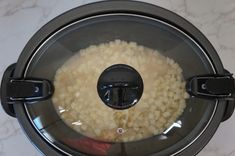 rice is being cooked in an electric pressure cooker