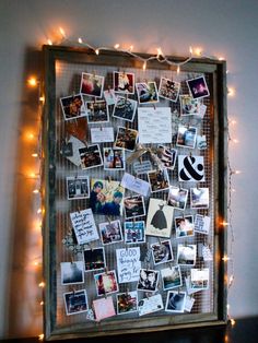 a bulletin board with pictures and lights on the wall in front of it is an instagram post