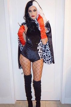 a woman dressed up in a costume with fishnet stockings