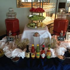 an assortment of condiments on a buffet table