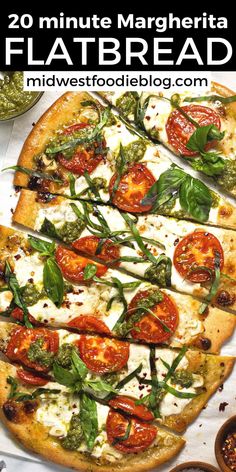 a pizza topped with tomatoes, basil and mozzarella