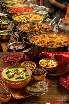 many different bowls and dishes on a table