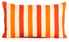 an orange and white striped pillow on a white background