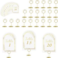 a set of table numbers and place cards with gold foil on the top, in different styles