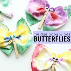 three butterfly shaped hair clips with the words tie - dye baby wipes on them