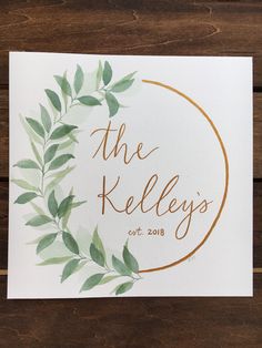 the keleys logo is shown on a piece of white paper with green leaves