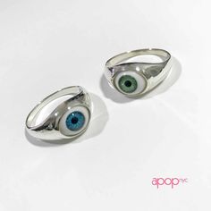 apop Original Evil eye ring is made of solid .925 sterling silver. Featuring a green glassy evil eye. Unisex. Eye has a natural-like appeal and may have a slight tilt giving it a totally cool "I C U" vibe. Bright. Measurements: eye area: .49 inch - .19 inch band width material 925 sterling silver, resin, epoxy Brown Evil Eye, Blue Evil Eye Ring, Eyeball Ring, Evil Eye Ring Silver, St Michael Pendant, Cheap Silver Rings, Handmade Gold Jewellery, Silver Necklaces Women, Black Onyx Necklace