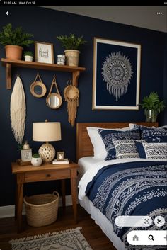 a bed room with a neatly made bed next to a night stand and two potted plants