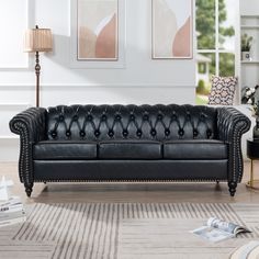 This classic and modern piece of furniture provides both supreme comfort and effortless class. Designed for simple elegance, this sofa is expertly crafted in supple, top-quality PU leather/polyester and superior construction. The timeless design of the collection will mix seamlessly into a traditional, eclectic, or modern aesthetic. The sofa combines the unique deep button tufting, nailhead accents, scrolled arms, and turned legs of classic style to create your favorite piece of sofa. You don't Sofa Chesterfield, Modern Sofa Couch, Faux Leather Sofa, Rolled Arm Sofa, Leather Couch, Black Sofa, Three Seater Sofa, Chesterfield Sofa, Living Room Furniture Sofas