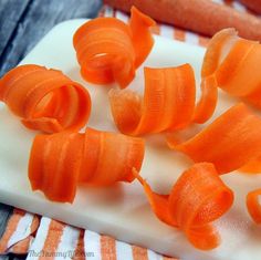 peeled carrots are on a cutting board