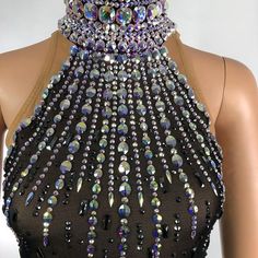 a black dress with lots of beads on it