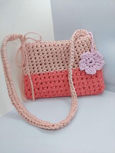 This striking handmade crochet bag features a vibrant mix of colors, making it a truly eye-catching accessory. Crafted from soft, durable yarn, it's perfect for carrying your essentials while adding a fun touch to any outfit. Its unique design and bold hues make it ideal for casual outings or special events, showcasing your personal style! Pink Crossbody Bag, Handmade Crochet Bags, Crochet Handbags, Crochet Gifts, Pink Bag, Handmade Crochet, Crochet Bag, Bags Handbags, Special Events