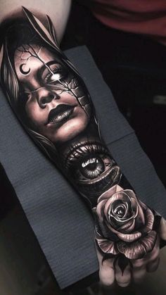 a woman's arm with an evil face and roses on it