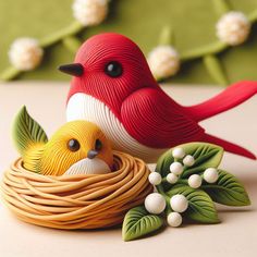 a red and white bird sitting on top of a nest next to another yellow bird