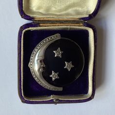 A fabulous Art Deco style brooch. 925 silver man in the moon, with ruby eye, framing a large polished onyx disc set with 3 beautiful silver and marcasite stars. A rare piece stamped 925 and in excellent condition. Measures approximately 2 inches diameter  Pin and roll over clasp  Weighs approximately 38.8 grams  Ruby eyed face The items for sale are in the most part from my own or family's (and now in some cases friends and further afield) large collection of quality antique and vintage jewellery. I will send the item in a pretty black velvet drawstring gift bag and securely packed. Boxes and bits are for the photographs only Please take a careful look at the photographs as they are an important part of my description and indication of condition Silver Man, Vintage Jewellery, Stars And Moon, Art Deco Fashion, Gift Bag, Onyx, 925 Silver, Moon, Art Deco