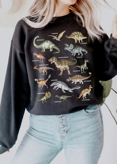 This Dinosaur sweatshirt is a perfect dinosaur gift for dinosaur lovers likes tyrannosaurus rex T-Rex, Stegosaurus,Parasaurolophus and velociraptor. Perfect to wear at fossil hunting, museums trips or a dinosaur theme birthday parties. Also available on tshirts: * https://www.etsy.com/listing/1276783667/dinosaur-shirt-dinosaur-print-shirt * https://www.etsy.com/listing/1262747862/dinosaur-shirt-dinosaur-print-shirt Browse through my other awesome items here: http://thenims.etsy.com/ ABOUT THE PR Cute Dinosaur Outfit Women, Cute Dinosaur Outfit, Dinosaur Clothes Women, Dinosaur T Shirt, Sweater Dinosaur, Dino Sweater, Dinosaur Clothes, Dinosaur Theme Birthday, Dinosaur Shirts