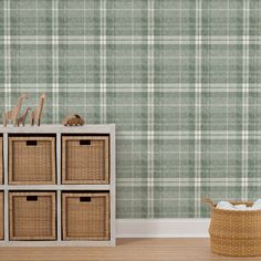 a green plaid wallpaper in a child's room with toy animals and baskets