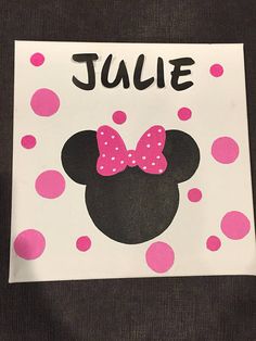 a minnie mouse birthday card with pink polka dots and a name that says julie