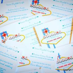 some white and blue business cards with the word welcome to las vegas on one side