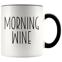 a black and white coffee mug with the words morning wine on it's side