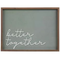 a wooden framed sign with the words better together written in cursive writing on it