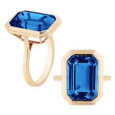 A classic yet an everyday bold statement piece, this amazing cocktail ring is part of our very new ‘Manhattan’ Collection. It has a 10 x 15 mm emerald cut London Blue Topaz in a bezel setting in 18k gold.   ​ Minimalist lines yet bold structures is what our Manhattan Collection is all about. Our pieces represent the famous skyline and cityscapes of New York City which people all over the world dream of seeing. You will be enraptured by our classic, yet flamboyant and colorful pieces….reminding y Formal Emerald Cut Topaz Ring With Bezel Setting, Elegant Faceted Emerald Cut Topaz Ring, Elegant Emerald Cut Faceted Topaz Ring, Formal Emerald Cut Faceted Topaz Ring, Formal Emerald-cut Topaz Ring With Bezel Setting, Sapphire Color Emerald-cut Topaz Wedding Ring, Luxury Emerald-cut Topaz Ring, Gold Emerald-cut Blue Topaz Ring, Formal Emerald-cut Faceted Topaz Ring