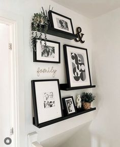 some black and white pictures hanging on the wall