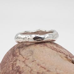 A simple, chunky ring with a molten silver effect.  Inspired by the flow of volcanic molten rock & metal.  Each ring is made to order and totally unique. A perfect ring to wear alone, stack or as an alternative wedding band. 100% Recycled Silver  Please allow 2-3 weeks for your ring to be made. For more information about me and the Jewellery I create, please visit my website - www.melissayarlett.co.uk Molten Rock, Rock Amp, Alternative Wedding Bands, Chunky Ring, Organic Jewelry, Rock Metal, Etsy Wedding Rings, Chunky Rings, Recycled Silver