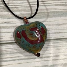 Handmade Turquoise Heart Ceramic Pendant Necklace, It’s Made By Me. The Necklace Is Made With A Hand Painted Ceramic Pendant On A Leather Cord. It Comes From A Smoke Free Home. Layered Cross Necklace, Ceramic Pendant Necklace, Anthropologie Necklace, Heart Ceramic, Open Heart Necklace, Sunflower Necklace, Leather Corded Necklace, Starfish Necklace, Turquoise Heart