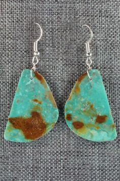 These turquoise and sterling silver earrings were made by Santo Domingo silversmith Tammy Nolcot.Length: 2 1/8"Width: 7/8"Free shipping on all orders! We ship with USPS and always include tracking. All orders ship within a day of payment.Returns are accepted up to 30 days after you receive your order. Just send us a message. Our shop offers cash back or store credit. The item must be returned in new condition. Handmade Turquoise Chrysoprase Earrings, Native American Jewelry, Turquoise Sterling Silver, Free Jewelry, Sterling Silver Earrings, Silver Earrings, Jewelry Watches, Turquoise, Drop Earrings