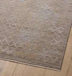 an area rug with wooden floors and wood flooring on top of it, in the middle