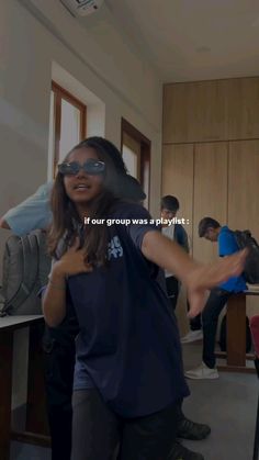 a group of people standing around each other in front of a tv screen with the caption if our group was playing