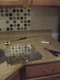 a kitchen counter with tools on top of it