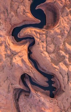 an aerial view of a river in the desert