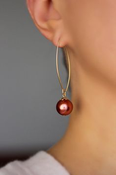 Lovely feminine earrings with bright carmine red color pearl coated glass 12 mm beads, gold tone bead caps and gold tone stainless steel oval shape earring hooks. Earring hooks are from nickel free and lead free metal. *The total lenght of earrings is about 56 mm including earring hooks. Perfect jewelry for everyday wear or a wonderful gift! Other earrings of my shop you can see here: https://www.etsy.com/shop/NaTavelli?section_id=13757927 Thanks for visit. Elegant Red Hoop Earrings, Elegant Red Beaded Hoop Earrings, Feminine Earrings, Red Pearl, Pearls Earrings, Earrings Big, Gold Dangle Earrings, Big Pearl, Earrings Unique