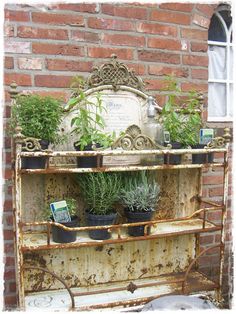 an old shelf with potted plants on it