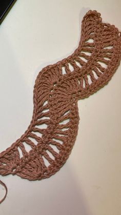 a crocheted tie sitting on top of a table