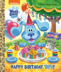 a blue dog birthday card with cupcakes, balloons and decorations on the table