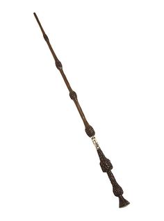 a long wooden stick with two handles on it's end and an arrow in the middle