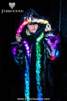 Unleash your inner style diva with our women's LED Faux Fur coats. Controlled by an easy-to-use Bluetooth app, these coats feature 200 stunning light changing patterns that are sure to turn heads wherever you go. More than just a fashion statement, these coats are warm, cozy, and built for convenience with five pockets and our signature backpack straps for those moments when you get too hot. Spark your fashion revolution today – Shop Now! Edm Festival Outfit, Outfits New Year, Festival Jacket