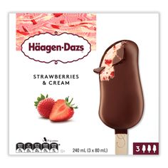 an ice cream bar with strawberries and cream on the top, in front of a card