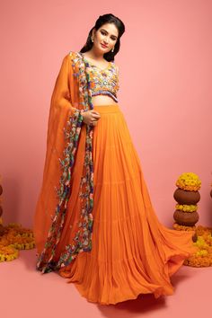 Orange embroidered lehenga in coin tassels and fringe detail. Paired with a tiered lehenga and scallop dupatta.
Components:3
Pattern:Embroidered
Type of Work:Coin tassels, Thread work
Neckline:V neck
Sleeve Length:Sleeveless
Fabric:Raw silk, Georgette, Organza
Color:Orange
Other Details:
Fringe dupatta
Note: Peach lehenga set worn by the other model is not for sale
Note: Please get in touch with our customer care service to customize the colour
Occasion:Reception,Sangeet - Aza Fashions Bohemian Lehenga With Gota Work In Traditional Drape, Bohemian Lehenga With Gota Work, Orange Embroidered Georgette Lehenga, Bohemian Choli With Gota Work And Traditional Drape, Orange Bohemian Choli For Navratri, Bohemian Orange Choli For Navratri, Bohemian Pre-draped Saree For Wedding And Festive Occasions, Bohemian Orange Traditional Wear For Wedding, Unstitched Bohemian Lehenga In Georgette