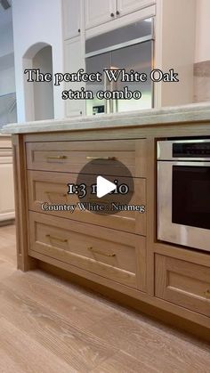 an image of a kitchen with white oak cabinets